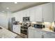 Kitchen with stainless appliances, white cabinets, granite countertops, and subway tile backsplash at 11990 E Pivot Peak --, Gold Canyon, AZ 85118