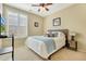 Bright bedroom with a comfortable bed and window shutters at 12692 N 152Nd Ave, Surprise, AZ 85379