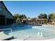 Resort-style pool with multiple seating areas and shade structures at 12692 N 152Nd Ave, Surprise, AZ 85379