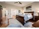 Bright main bedroom with hardwood floors and ensuite bathroom access at 13286 W Micheltorena Ct, Sun City West, AZ 85375