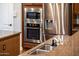 Stainless steel kitchen appliances, including a microwave and oven at 13286 W Micheltorena Ct, Sun City West, AZ 85375