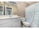 Bright bathroom with a large mirror, white vanity, and shower-tub combination at 134 N 87Th St, Mesa, AZ 85207
