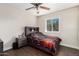 Bedroom with tile flooring, large window, and modern gray furniture at 134 N 87Th St, Mesa, AZ 85207