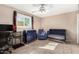 Comfortable bedroom features natural light, neutral walls, and a cozy carpet at 134 N 87Th St, Mesa, AZ 85207