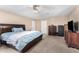 Serene bedroom featuring a ceiling fan and neutral colors, creating a calming atmosphere at 134 N 87Th St, Mesa, AZ 85207