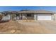 Charming single-story home featuring a cozy porch, a brick pathway, and a well-maintained yard at 134 N 87Th St, Mesa, AZ 85207