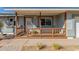Inviting front porch with wood railings, offering a cozy spot to relax and enjoy the outdoors at 134 N 87Th St, Mesa, AZ 85207