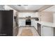 Bright kitchen with stainless steel appliances, white cabinets, and modern countertops at 134 N 87Th St, Mesa, AZ 85207