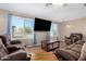 Comfortable living room with large windows, providing ample natural light and cozy seating at 134 N 87Th St, Mesa, AZ 85207