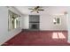 Living room with fireplace and burgundy carpet at 13802 N 183Rd Ave, Surprise, AZ 85388