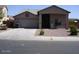One-story house with attached garage and small front yard at 14970 W Riviera Dr, Surprise, AZ 85379