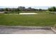 Community park with grassy area and a sand volleyball court at 14970 W Riviera Dr, Surprise, AZ 85379