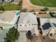 Aerial view of house, pool, and surrounding properties at 15058 W Fillmore St, Goodyear, AZ 85338