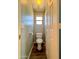 Small powder room with toilet and window at 15058 W Fillmore St, Goodyear, AZ 85338