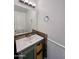 Updated bathroom with a modern vanity and wood-look accents at 15058 W Fillmore St, Goodyear, AZ 85338