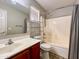 Bathroom features a tub, toilet, and vanity at 15058 W Fillmore St, Goodyear, AZ 85338