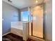 Bathroom features a shower and bathtub at 15058 W Fillmore St, Goodyear, AZ 85338