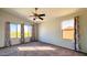 Bright bedroom featuring large windows and carpeted floor at 15058 W Fillmore St, Goodyear, AZ 85338