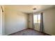 Bright bedroom with window, carpet, and closet at 15058 W Fillmore St, Goodyear, AZ 85338
