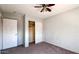 Bedroom with closet and ceiling fan at 15058 W Fillmore St, Goodyear, AZ 85338