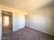 Bedroom with access to another room and closet at 15058 W Fillmore St, Goodyear, AZ 85338