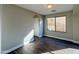 Bright bedroom with wood-look floors and neutral walls at 15058 W Fillmore St, Goodyear, AZ 85338