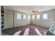 Spacious bedroom with multiple windows and ceiling fan at 15058 W Fillmore St, Goodyear, AZ 85338