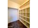 Walk-in closet with shelving and hanging rod at 15058 W Fillmore St, Goodyear, AZ 85338