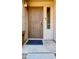 Front entrance with security door and welcoming doormat at 15058 W Fillmore St, Goodyear, AZ 85338