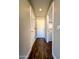 Clean and bright hallway with wood-look flooring at 15058 W Fillmore St, Goodyear, AZ 85338