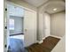 Hardwood floor hallway with access to bedrooms and other rooms at 15058 W Fillmore St, Goodyear, AZ 85338