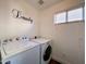 Laundry room with washer and dryer included at 15058 W Fillmore St, Goodyear, AZ 85338