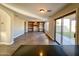 Spacious living room with hardwood floors and built-in shelves at 15058 W Fillmore St, Goodyear, AZ 85338