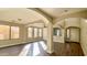 Sunlit living room with high ceilings and hardwood floors at 15058 W Fillmore St, Goodyear, AZ 85338
