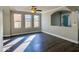 Spacious living room with hardwood floors and lots of natural light at 15058 W Fillmore St, Goodyear, AZ 85338