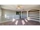 Loft area with built-in shelves and carpeted floors at 15058 W Fillmore St, Goodyear, AZ 85338