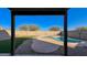 Relaxing kidney shaped pool in backyard oasis at 15058 W Fillmore St, Goodyear, AZ 85338