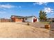 Spacious backyard with gravel and partial view of the home at 1561 W 5Th St, Mesa, AZ 85201