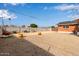 Backyard with gravel, landscaping and partial view of house at 1561 W 5Th St, Mesa, AZ 85201
