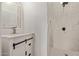 Charming bathroom with white vanity, marble shower, and geometric floor at 1561 W 5Th St, Mesa, AZ 85201