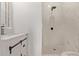 Stylish bathroom with white vanity, marble shower, and black accents at 1561 W 5Th St, Mesa, AZ 85201
