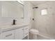 Modern bathroom with white vanity, marble shower, and patterned floor at 1561 W 5Th St, Mesa, AZ 85201