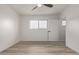 Bright bedroom with ceiling fan and wood-look floors at 1561 W 5Th St, Mesa, AZ 85201