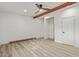 Spacious bedroom with light wood flooring and ceiling fan at 1561 W 5Th St, Mesa, AZ 85201