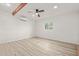 Bright bedroom with white brick walls, wood flooring and ceiling fan at 1561 W 5Th St, Mesa, AZ 85201