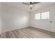 Simple bedroom with light wood flooring and large window at 1561 W 5Th St, Mesa, AZ 85201