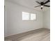 Comfortable bedroom with light wood flooring and large window at 1561 W 5Th St, Mesa, AZ 85201