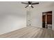 Cozy bedroom with ceiling fan, closet, and wood-look floors at 1561 W 5Th St, Mesa, AZ 85201