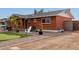 Brick home with putting green, walkway and side yard at 1561 W 5Th St, Mesa, AZ 85201