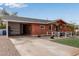 Brick home with carport and updated landscaping at 1561 W 5Th St, Mesa, AZ 85201
